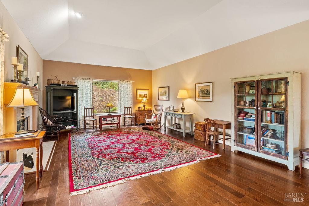 6252 Meadowstone Drive Santa Rosa, CA 95409 - Photo 15 of 33 a living room with furniture flat screen tv and a rug