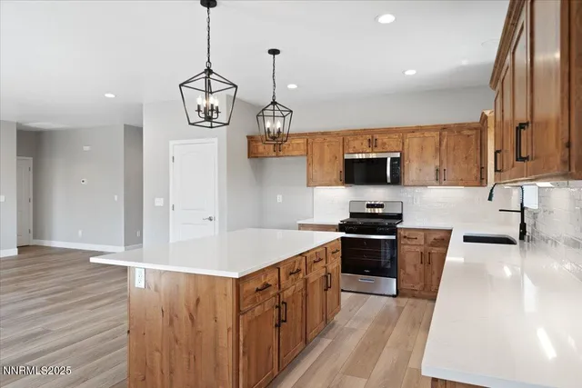 a kitchen with a table and chairs