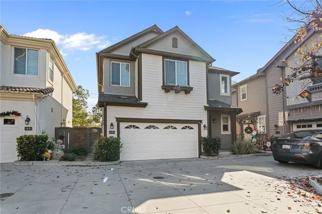 a front view of a house with parking