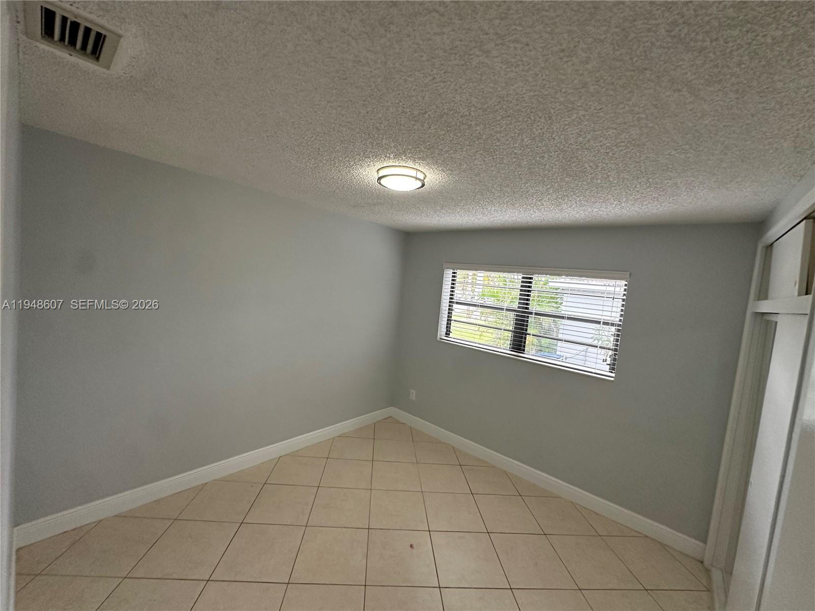 7860 Southwest 16th Street Miami, FL 33155 - Photo 15 of 32 an empty room with windows