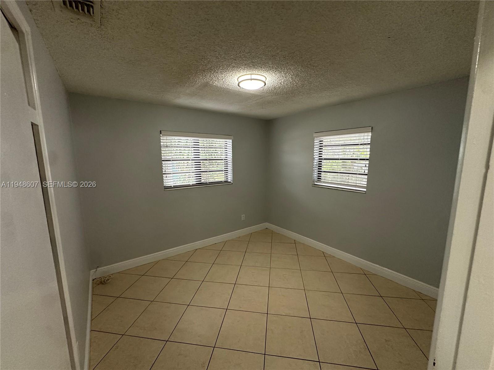 7860 Southwest 16th Street Miami, FL 33155 - Photo 18 of 32 a view of an empty room and window