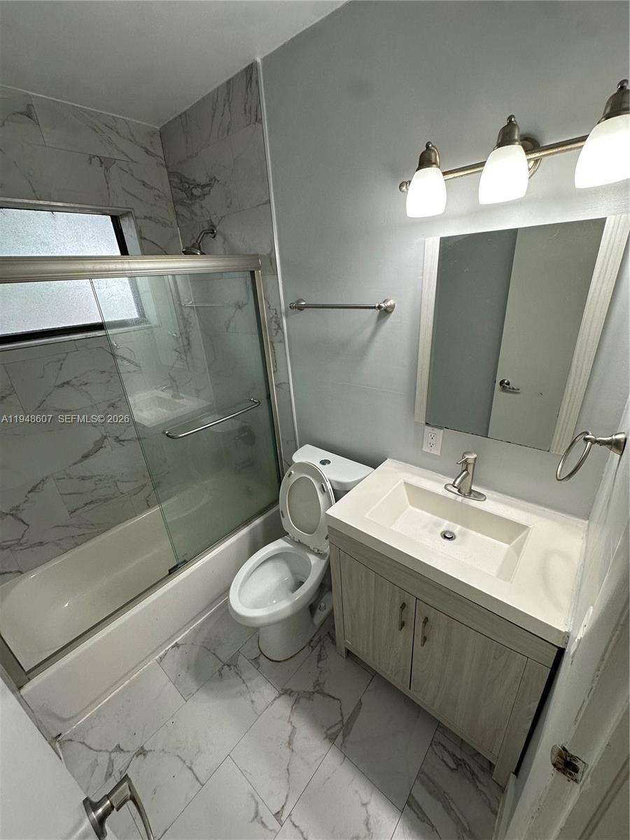 7860 Southwest 16th Street Miami, FL 33155 - Photo 20 of 32 a bathroom with a sink and mirror