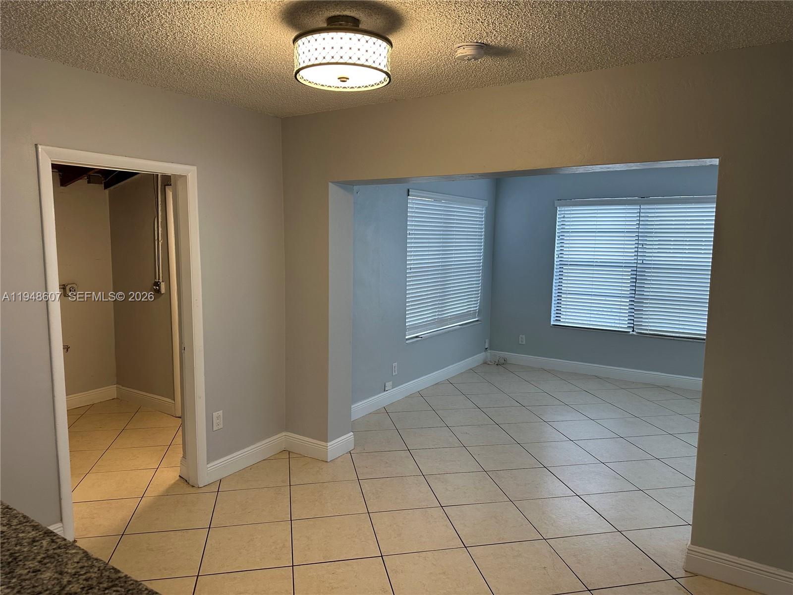 7860 Southwest 16th Street Miami, FL 33155 - Photo 24 of 32 an empty room with windows