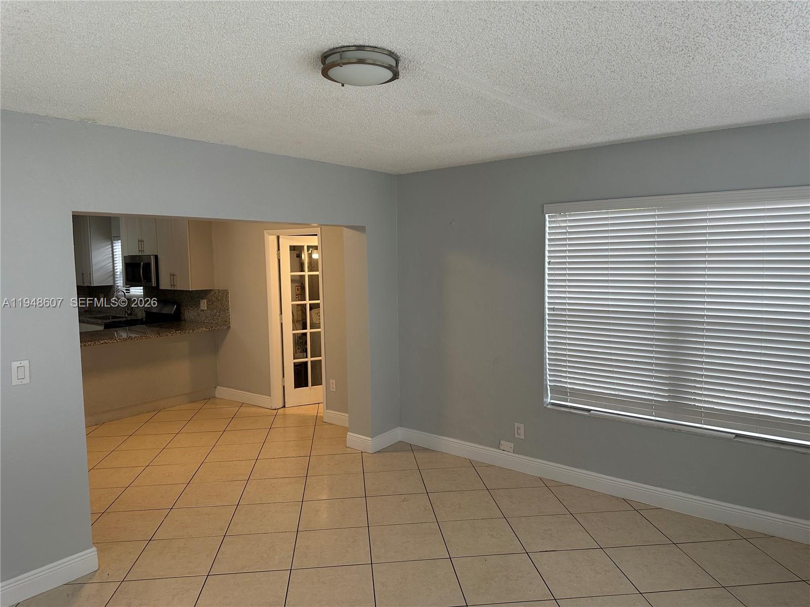 7860 Southwest 16th Street Miami, FL 33155 - Photo 27 of 32 a view of an empty room with a window