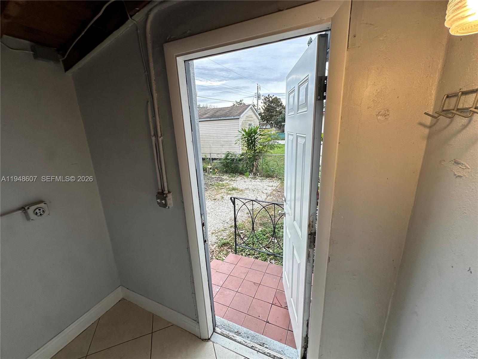 7860 Southwest 16th Street Miami, FL 33155 - Photo 32 of 32 a view of a glass door and a porch