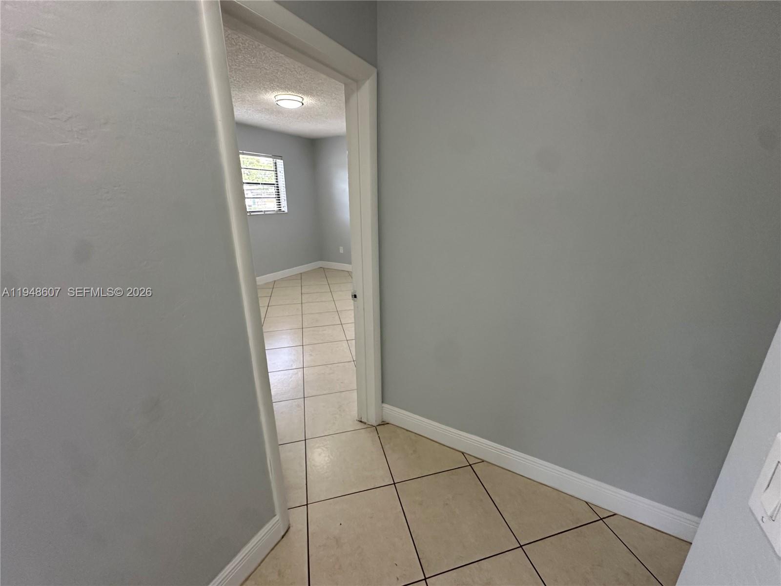 7860 Southwest 16th Street Miami, FL 33155 - Photo 9 of 32 a view of an empty room with closet and mirror