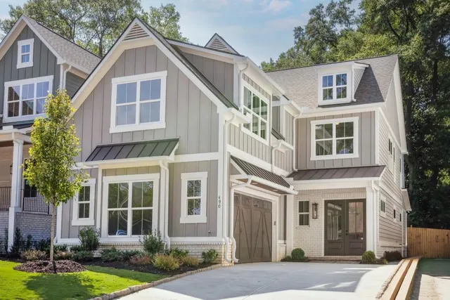 a view of a hallway with wooden floor and entryway
