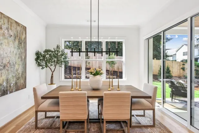a view of a living room with furniture potted plant and a window