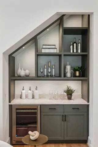 a hallway view with furniture and wooden floor