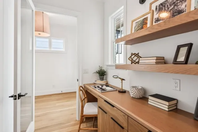 a bedroom with a bed and a potted plant