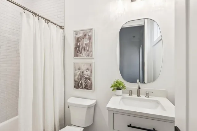 a living room with furniture flowerpot and window