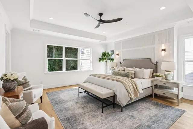 a white bath tub sitting in a bathroom and sink