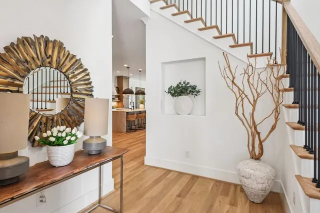 a kitchen with a table chairs sink and cabinets