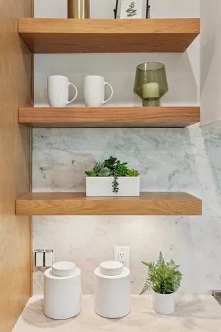 a kitchen with stainless steel appliances granite countertop a refrigerator and a cabinets