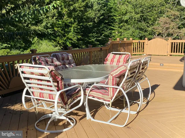 a patio with table and chairs