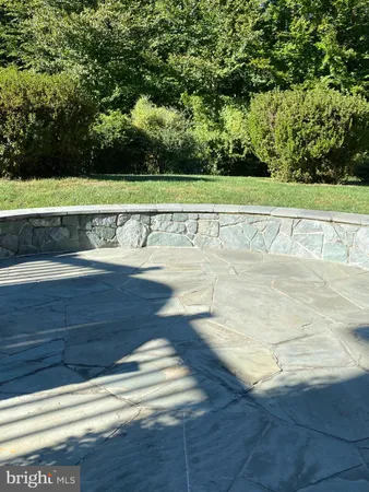 a view of a swimming pool and a yard
