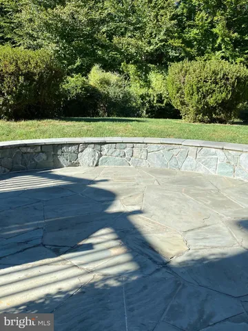 a view of a swimming pool and a yard