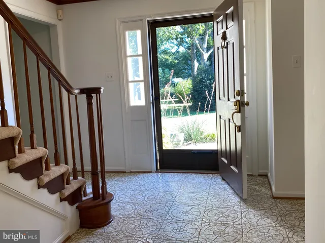 a view of an empty room and floor to ceiling window
