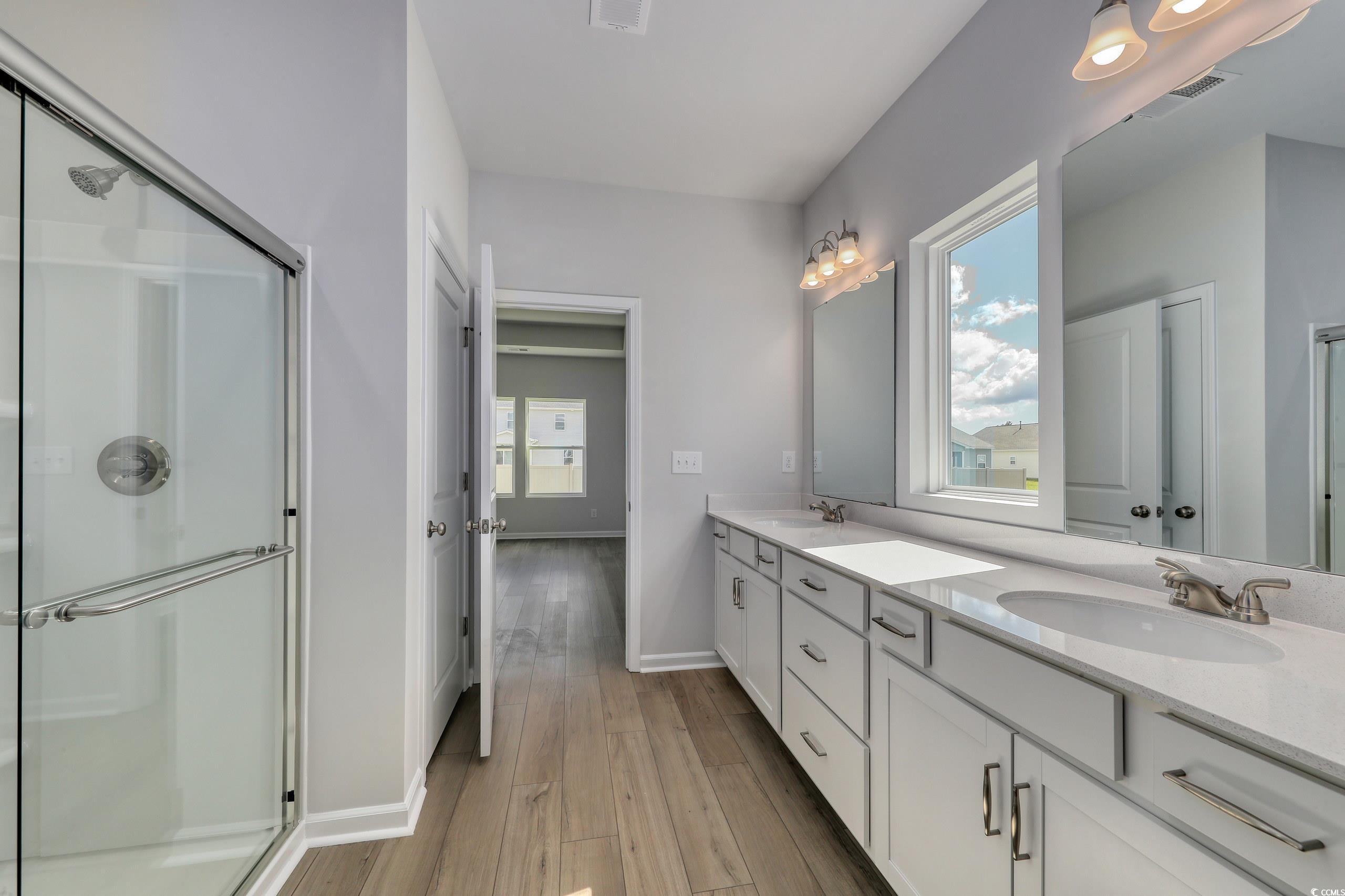 732 St Albans Loop Conway, SC 29526 - Photo 12 of 21 Bathroom with hardwood / wood-style floors, a show