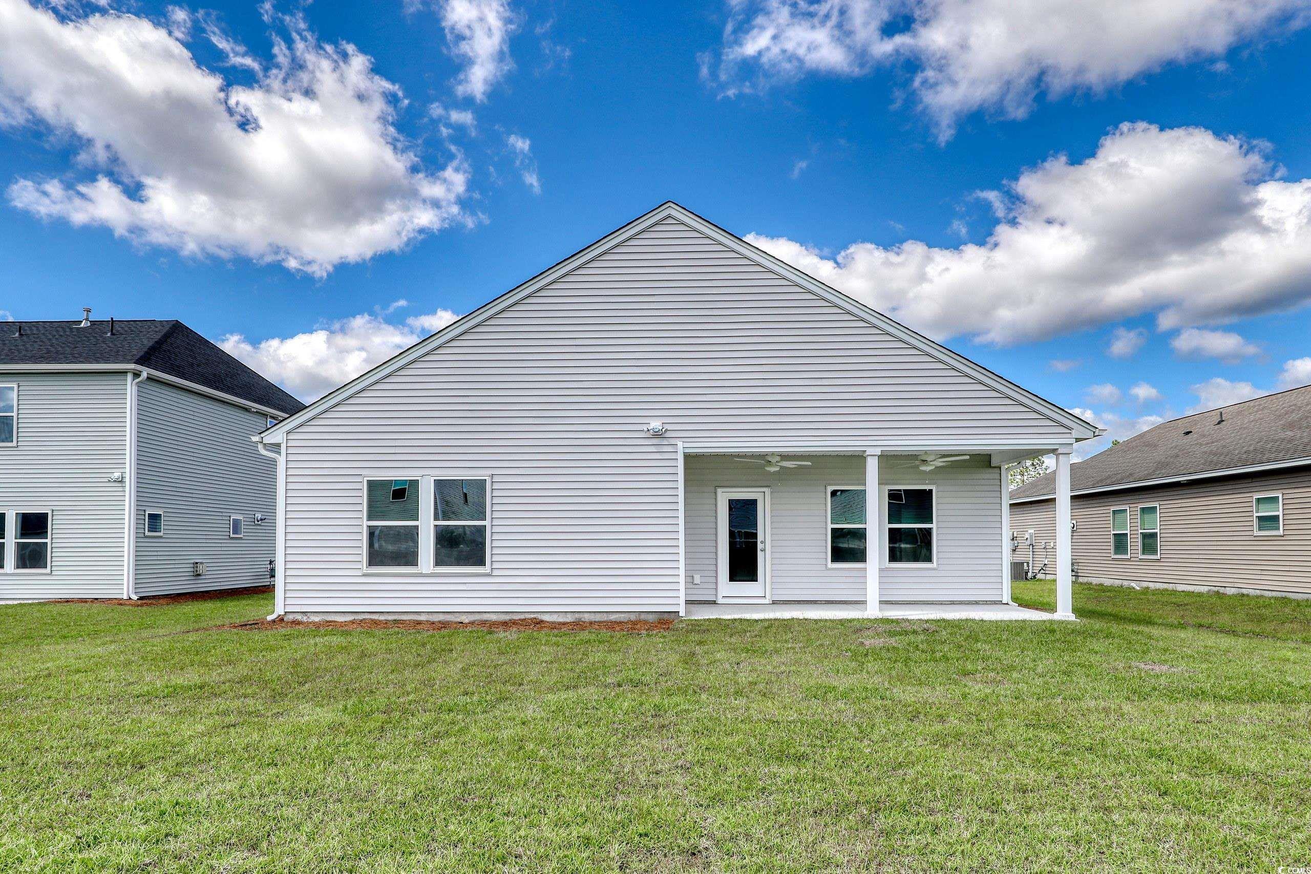 732 St Albans Loop Conway, SC 29526 - Photo 17 of 21 Back of house with a yard and a patio area