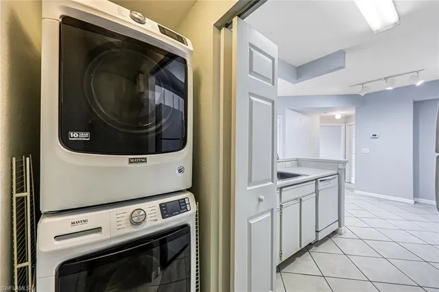 a kitchen with white cabinets and a stove top oven