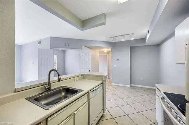 a kitchen with a sink and cabinets