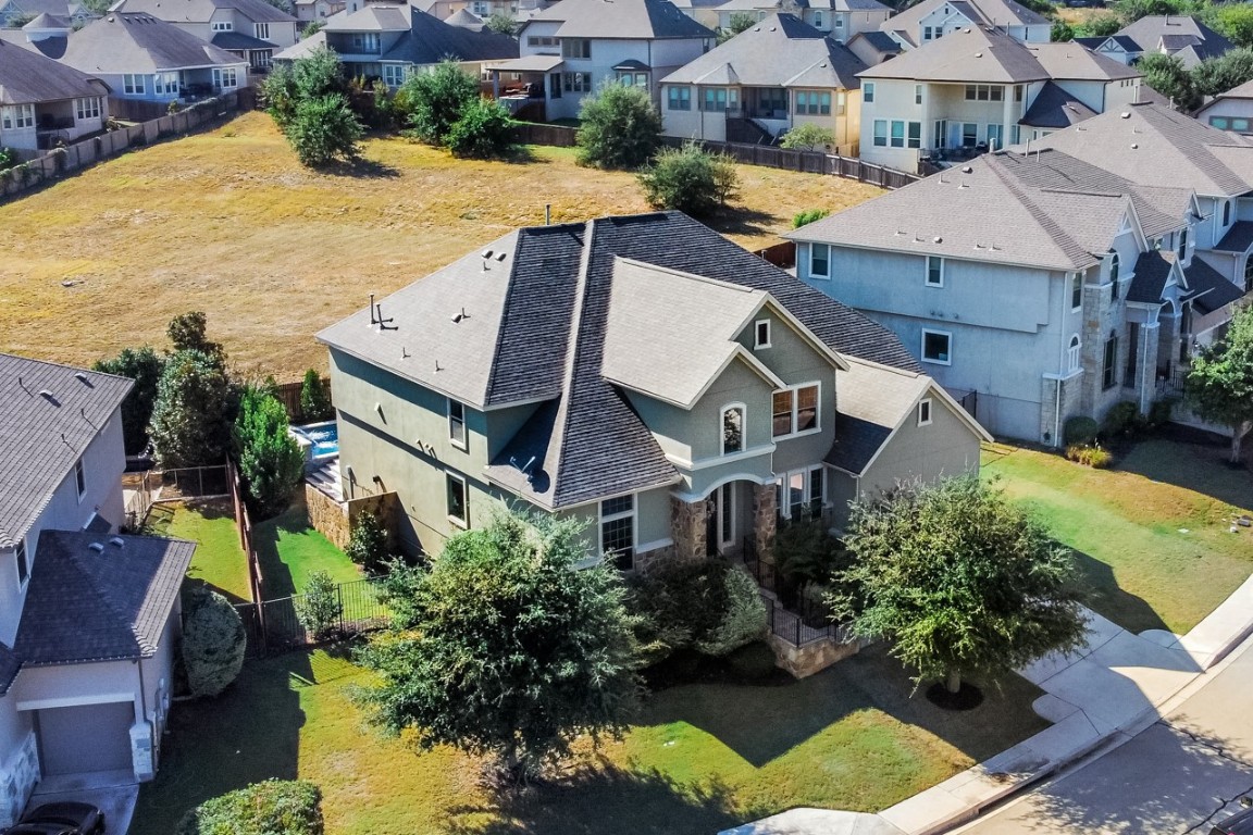 an aerial view of a house with a swimming pool