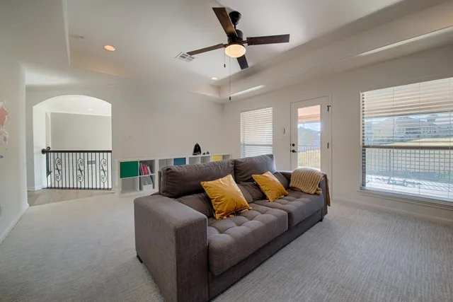 a living room with furniture and a window