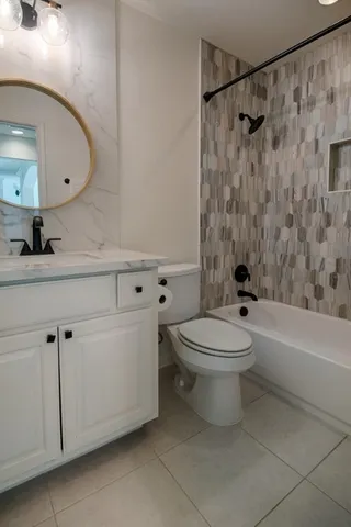 a bathroom with a toilet a sink and a bathtub