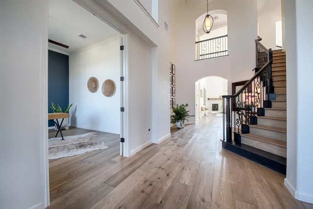a view of entryway with wooden floor and stairs