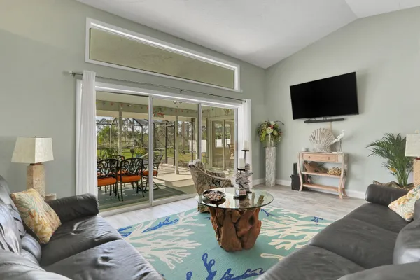 a kitchen with stainless steel appliances granite countertop a sink and a refrigerator