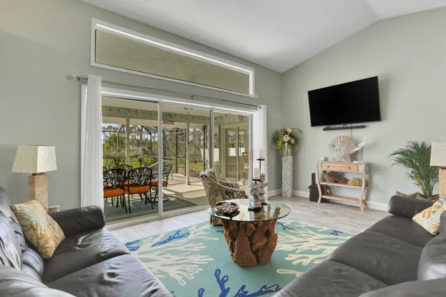 a kitchen with stainless steel appliances granite countertop a sink and a refrigerator