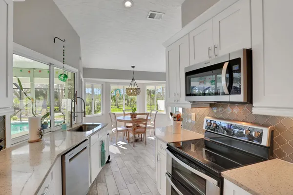 a view of a dining room with furniture window and outside view