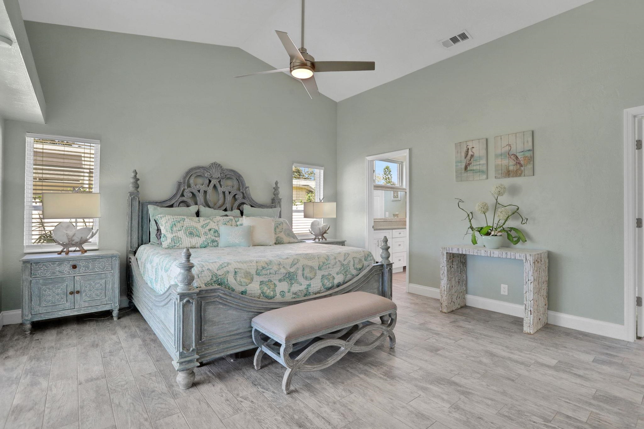 1075 Lambert Avenue Flagler Beach, FL 32136 - Photo 24 of 71 a bedroom with a bed and a table