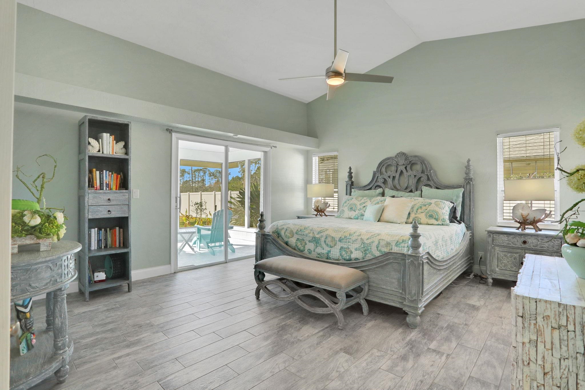 1075 Lambert Avenue Flagler Beach, FL 32136 - Photo 25 of 71 a bedroom with a bed and a couch