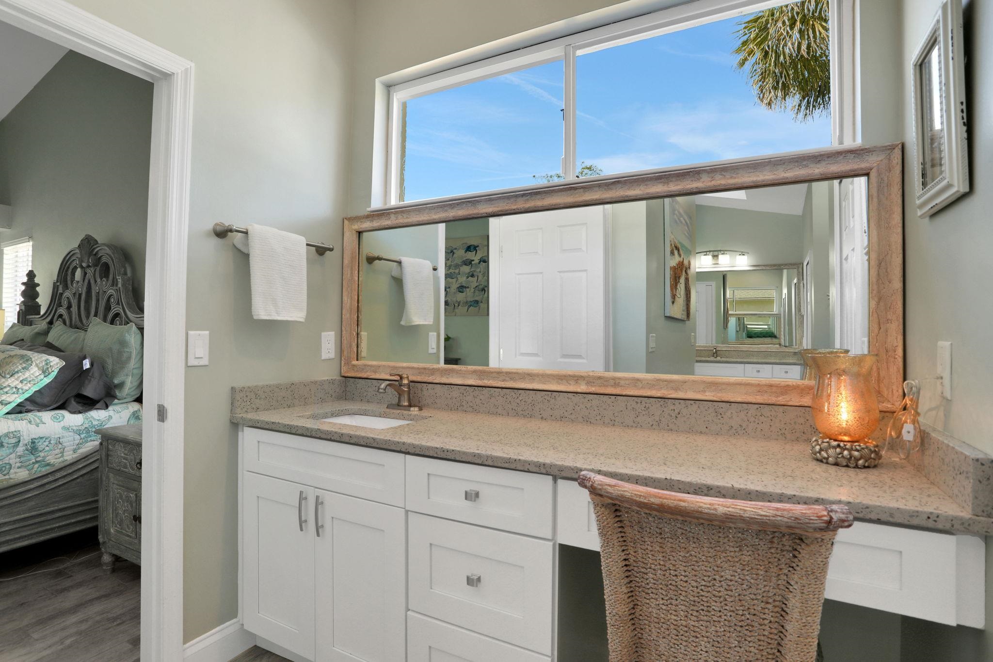 1075 Lambert Avenue Flagler Beach, FL 32136 - Photo 28 of 71 a bathroom with a granite countertop sink and a mirror