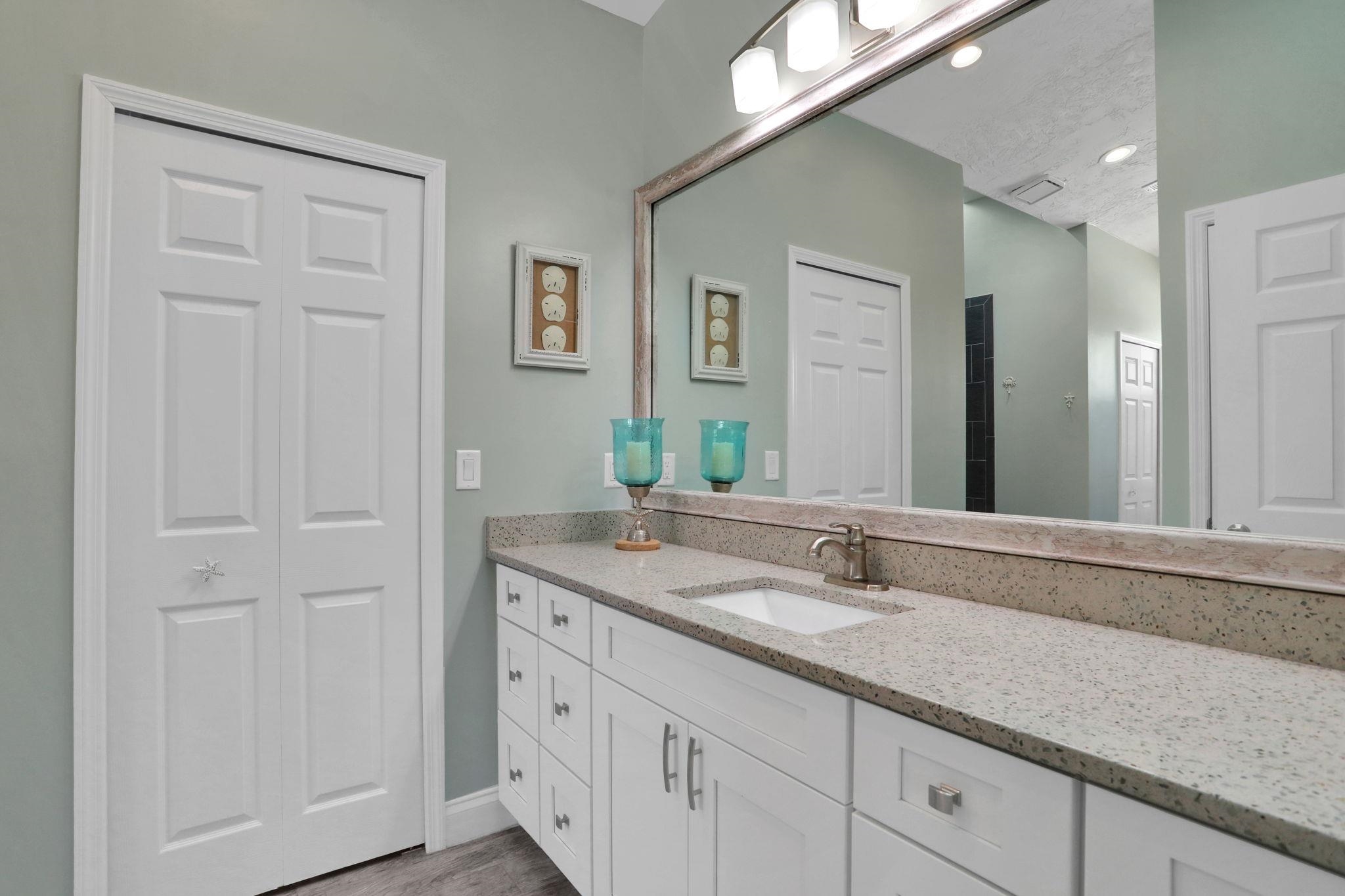 1075 Lambert Avenue Flagler Beach, FL 32136 - Photo 32 of 71 a bathroom with a sink and a mirror
