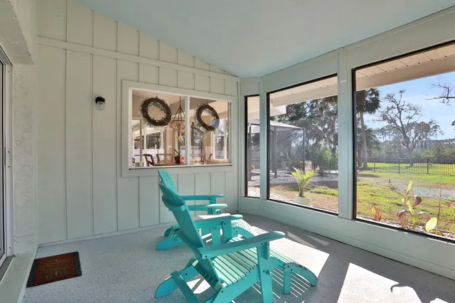 a view of a dining room with furniture wooden floor and a chandelier