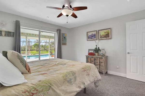 a view of a backyard with sitting area