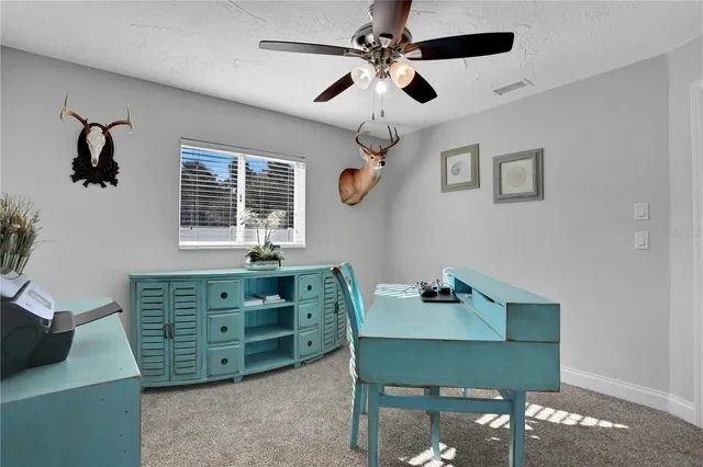 a view of swimming pool with a patio