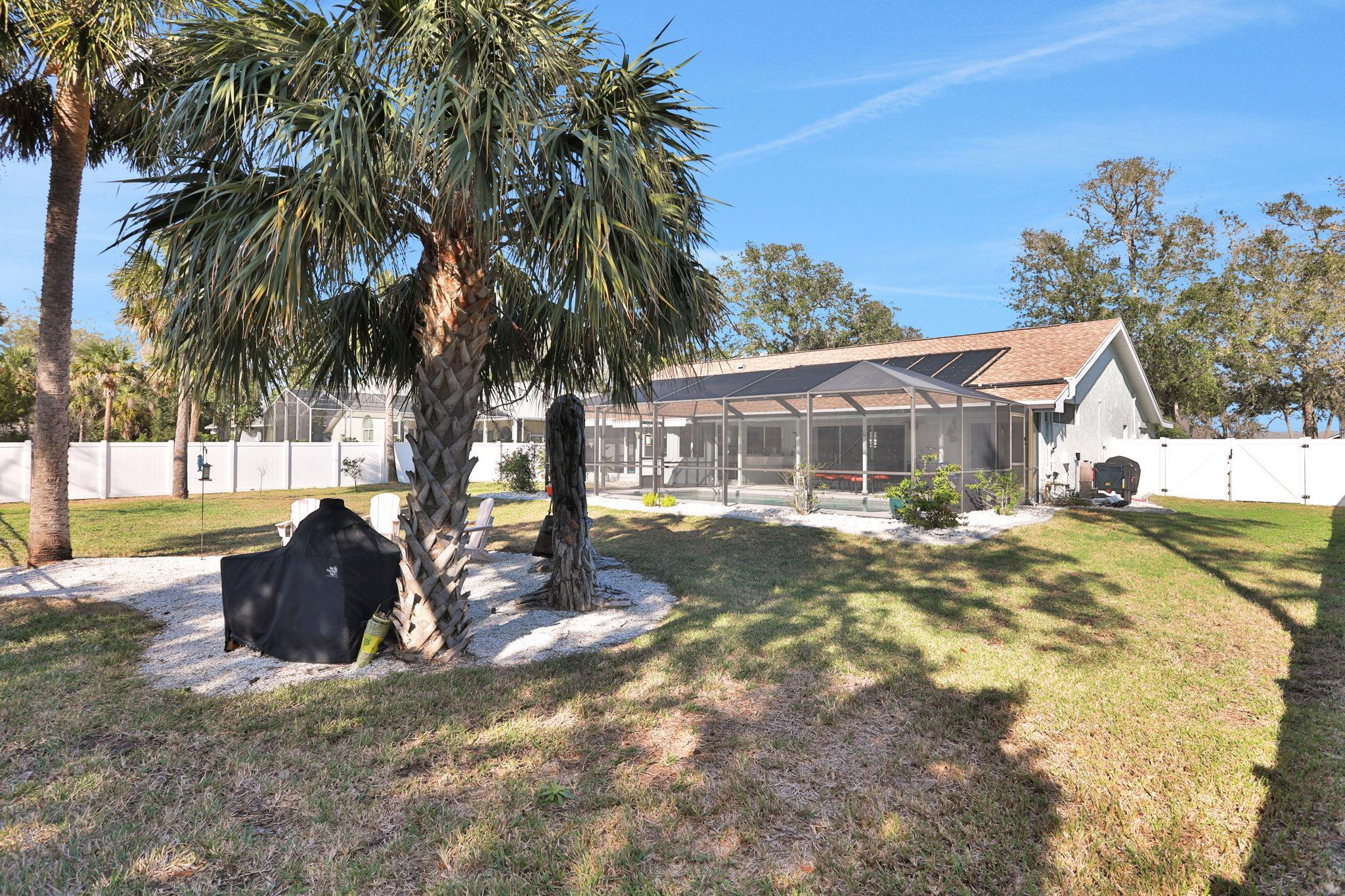 1075 Lambert Avenue Flagler Beach, FL 32136 - Photo 52 of 71 a front view of a house with a yard