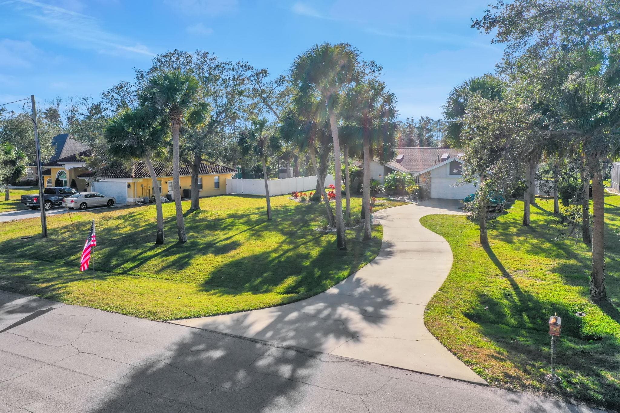 1075 Lambert Avenue Flagler Beach, FL 32136 - Photo 67 of 71 a view of a swimming pool with an outdoor space and seating area