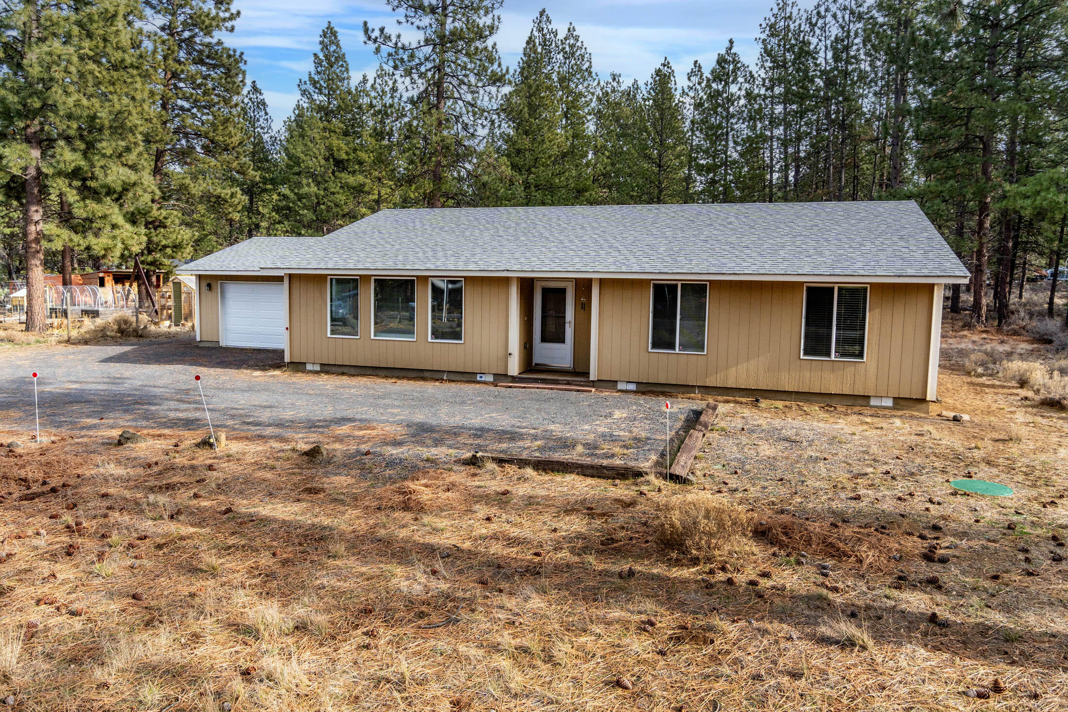 60196 Navajo Road Bend, OR 97702 - Photo 2 of 23 Home is perfectly situated on the lot for upside potential. Room in back for a shop, barn, greenhouse, or other structures. The septic system and reserve area are all in front, leaving the back open for other uses.