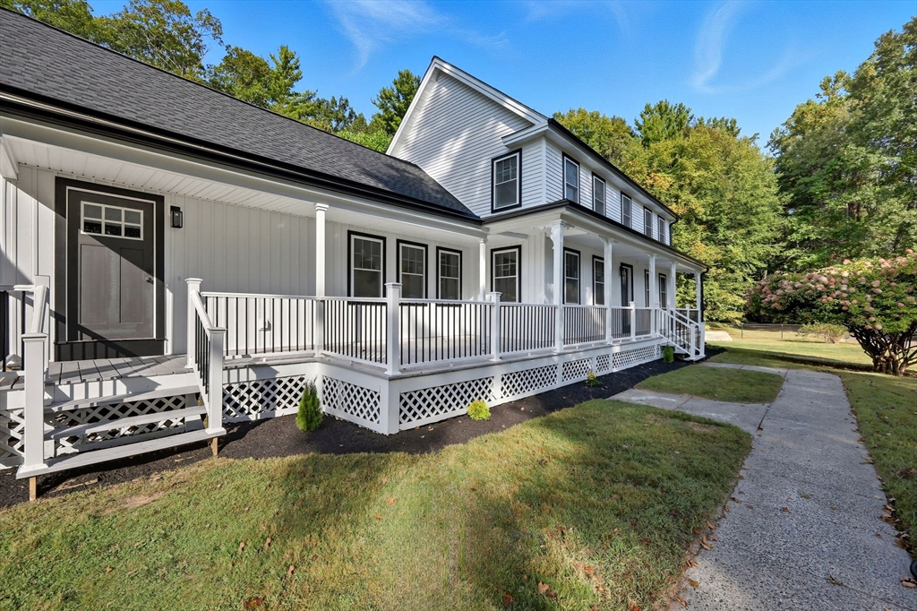 75 Lead Mine Road Southampton, MA 01073 - Photo 6 of 42 a front view of a house with a yard table and chairs