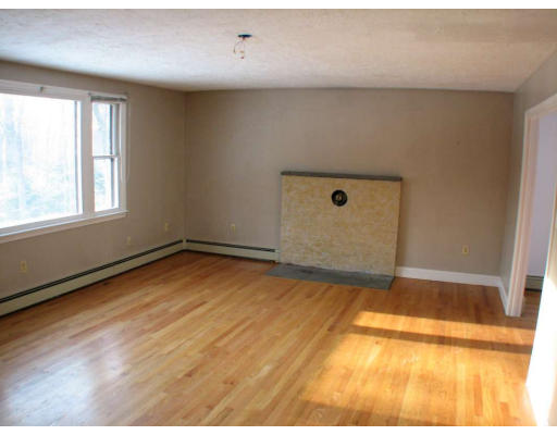 49 Baldpate Road Georgetown, MA 01833 - Photo 3 of 13 an empty room with windows