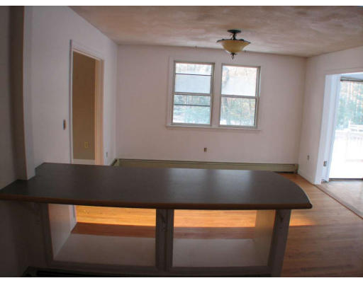 49 Baldpate Road Georgetown, MA 01833 - Photo 5 of 13 a view of empty room with wooden floor and a window