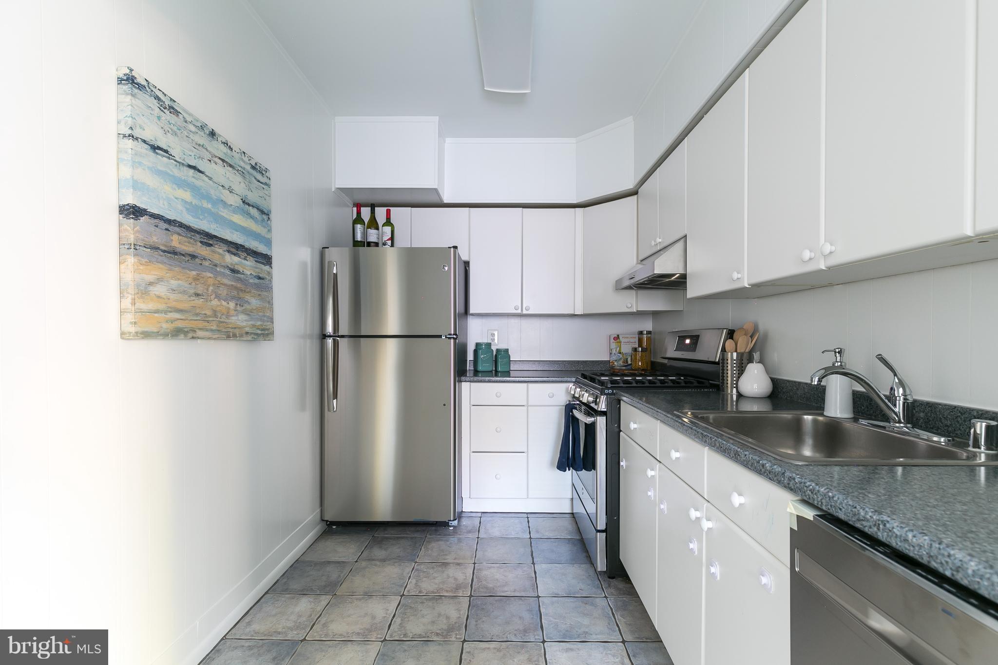 5101 8th Road South, Unit 7 Arlington, VA 22204 - Photo 11 of 32 a kitchen with stainless steel appliances granite countertop a refrigerator a stove a sink and a refrigerator