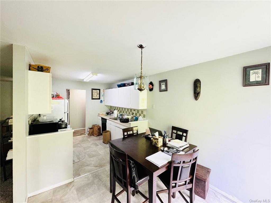 3(33J) Hook Road, Unit 14E Poughkeepsie, NY 12601 - Photo 4 of 12 a view of a dining room with furniture