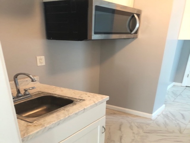 4603 Talley Road Millington, TN 38053 - Photo 13 of 16 a close view of a sink and dishwasher in kitchen