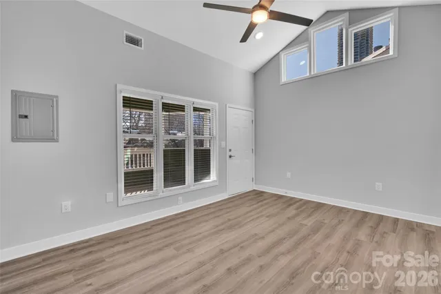 a view of a kitchen with dining table and chairs